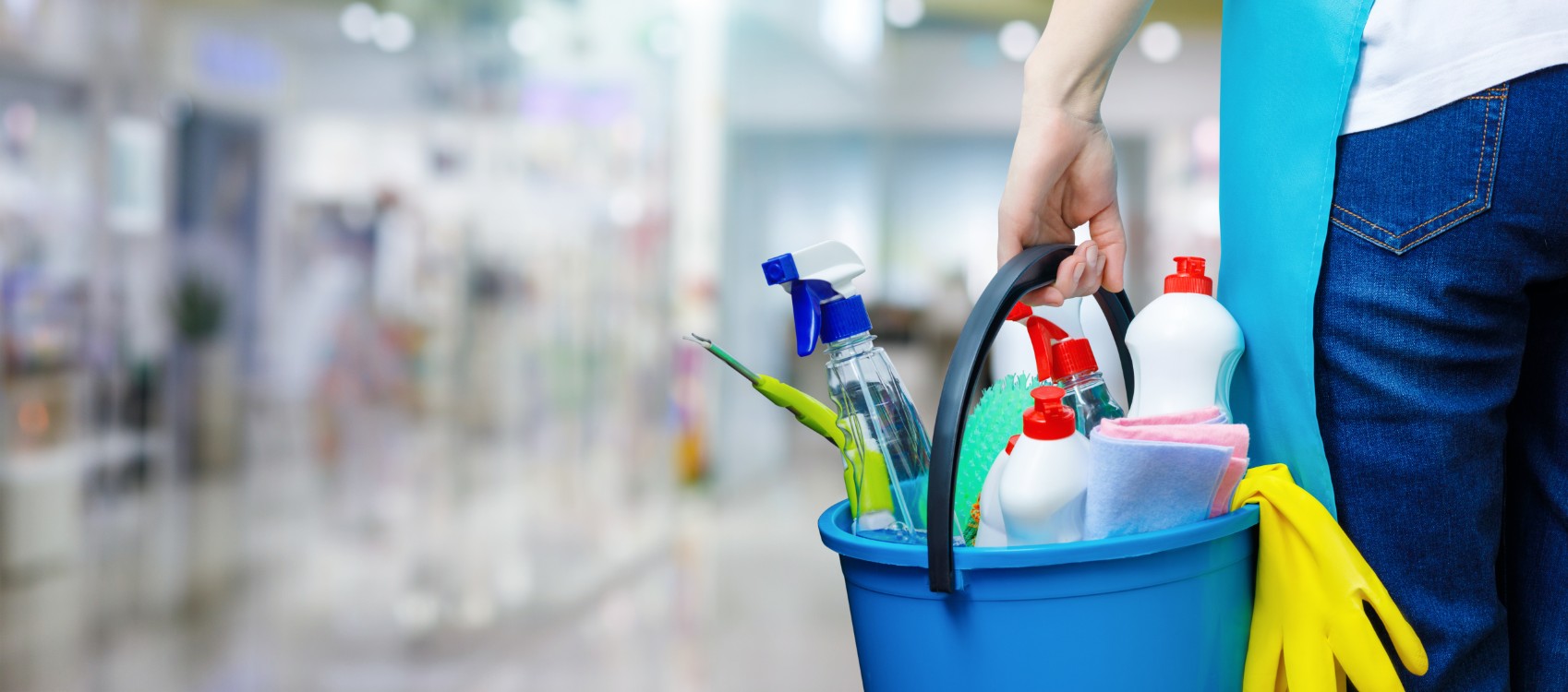 Professional cleaning equipment display showing various cleaning supplies, mops, and eco-friendly cleaning solutions arranged neatly